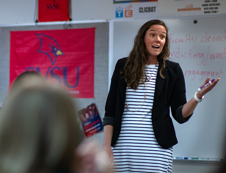 Adult speaking in front of class
